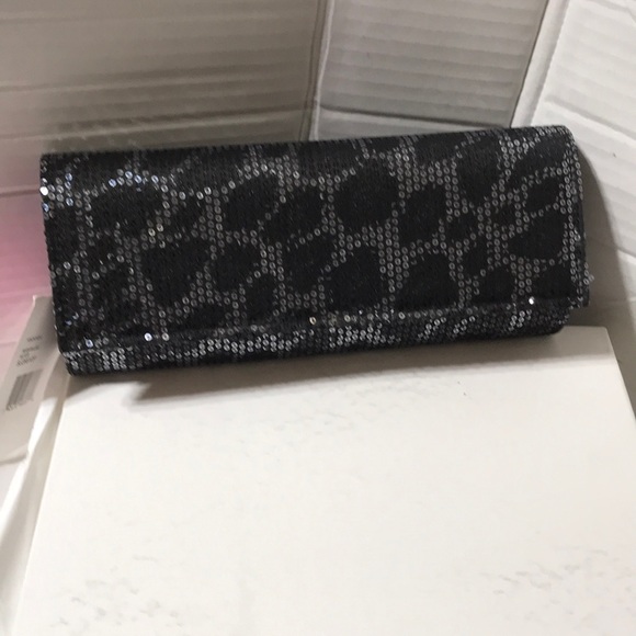 Betsey Johnson Handbags - Betsey Johnson Sequin Leo silver clutch with silver tone strap. NWT